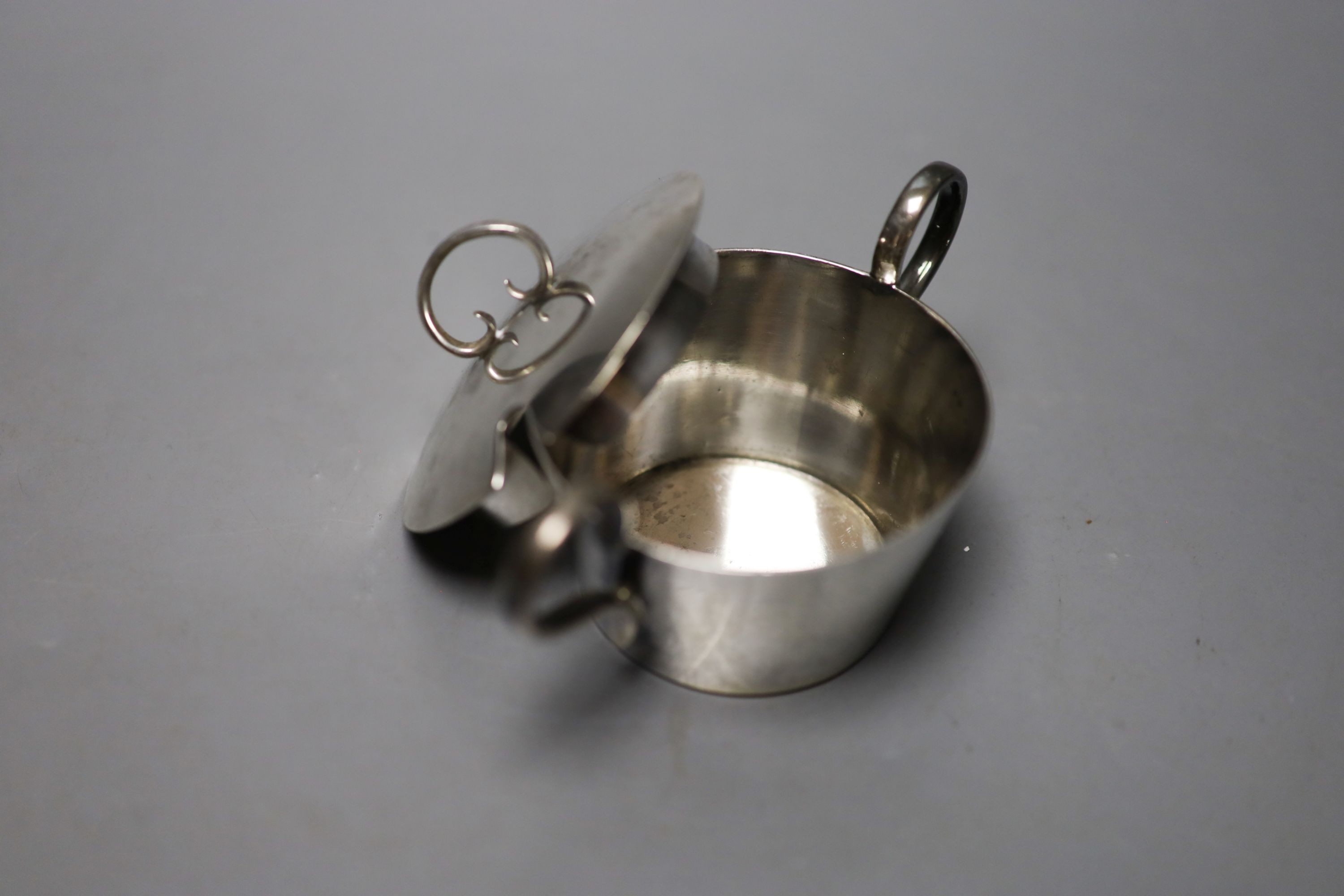 A pair of Victorian silver bun salts, London, 1859, two silver spoons, two mounted whisky tot jug (one a.f.), a silver cream jug, a silver napkin ring and a silver two handled pot and cover.